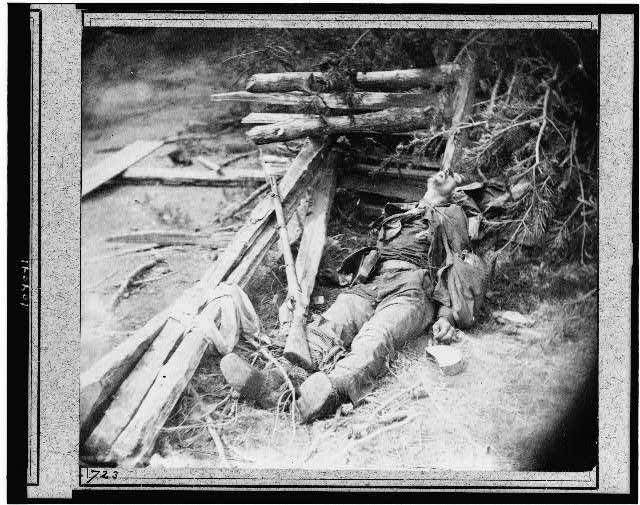 Dead Confederate soldier as he lay on the field, after the battle of the 19th May, near Mrs. Allsop's, Pine Forest, 3 miles from Spottsylvania. Timothy H. O'Sullivan, photographer. Library of Congress. 