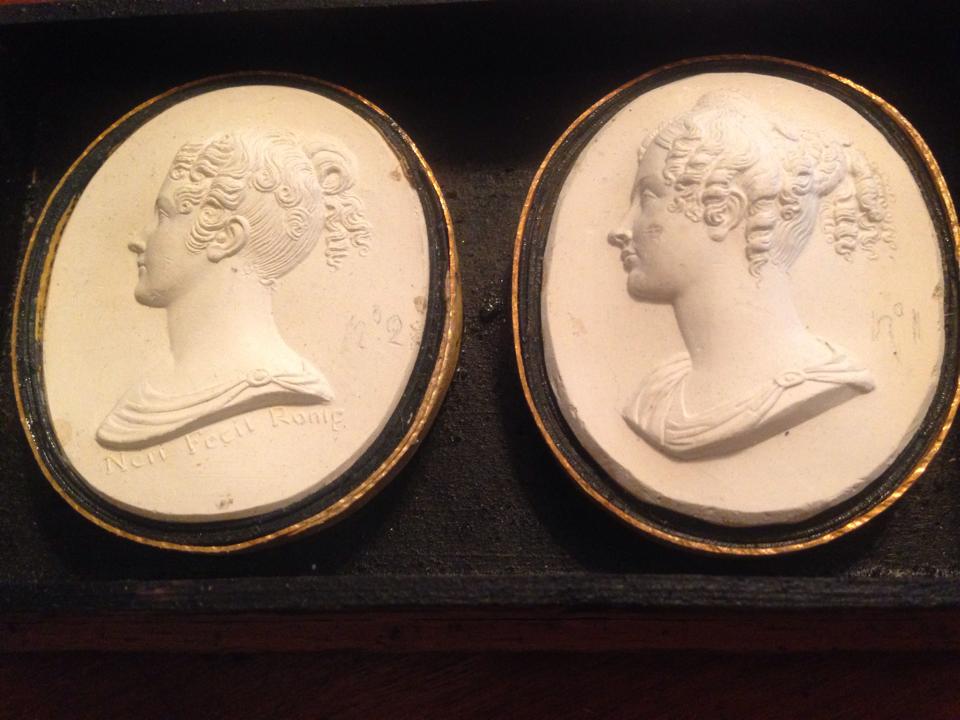 "Inside were two lovely plaster cameos with delicate gold edging..."