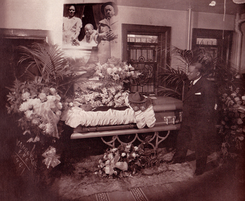 Sepia toned photo of a viewing from James Van Der Zee's 