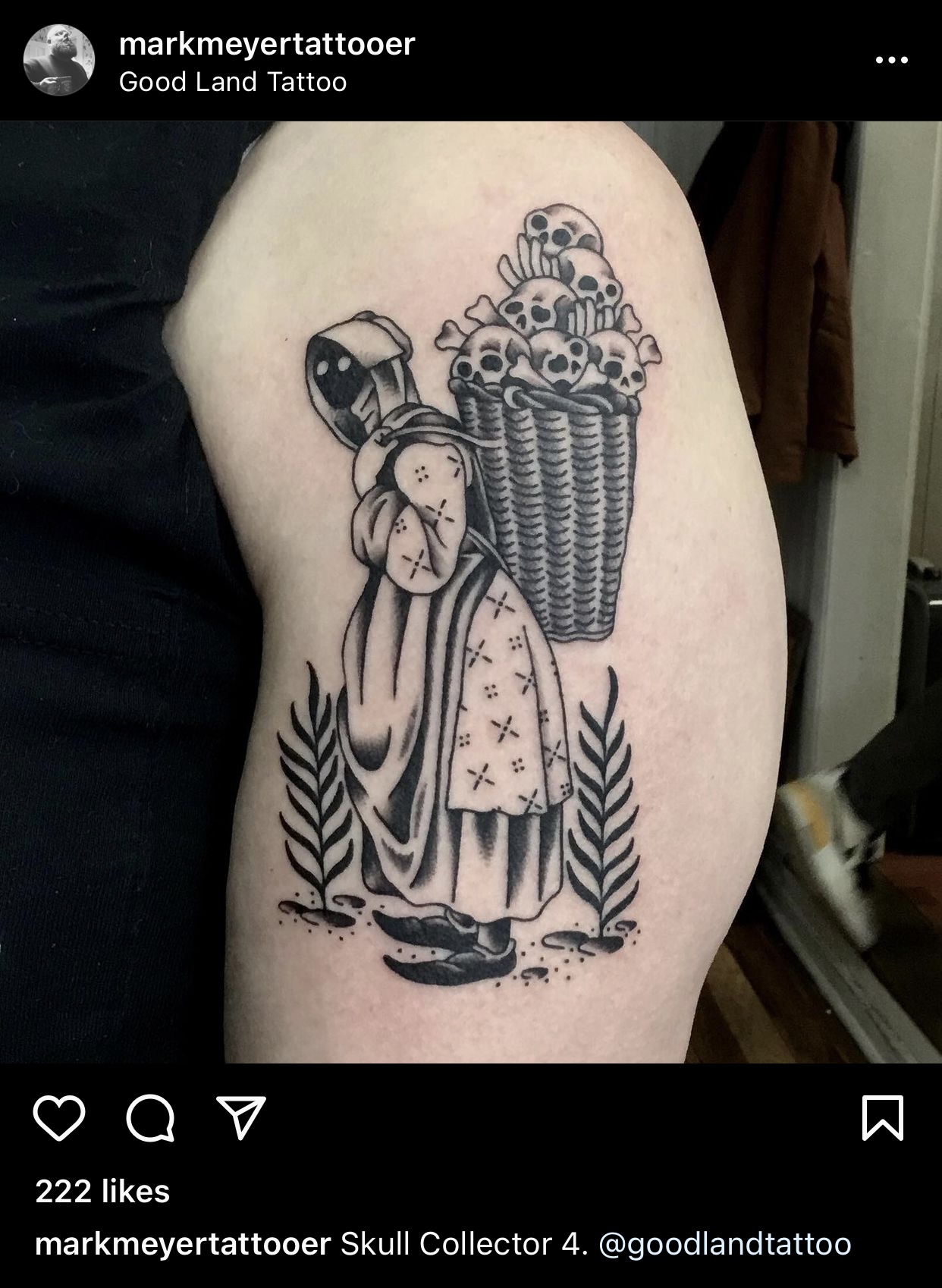 Black ink tattoo on light skinned upper arm of faceless person in flawy dress and apron carrying a basket of skulls on their back.