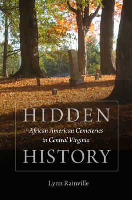 Book cover featuring trees with green and brown leaves, leaves cover the ground. In the foreground is the book's title Hidden History: African American Cemeteries In Central Virginia by Lynn Rainville