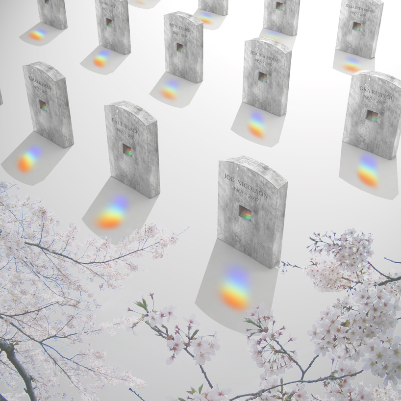 Rows of marble tombstones that reflect rainbows on the ground in front of them