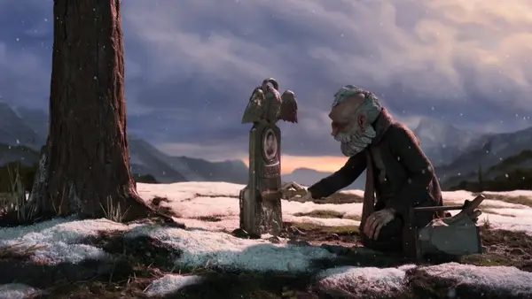 Scene from stop motion animated film Pinnocchio, of Gepetto kneeling in the show in front of his son's grave.