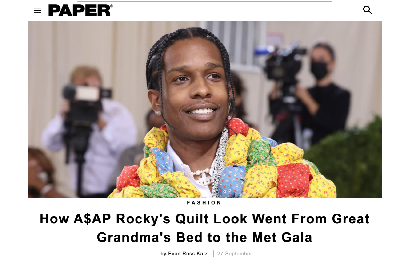 Screen grab image of Paper article featuring A$AP Rocky from the shoulders up, at the met gala in 2021, wearing a colorful quilt garment. The headline reads 