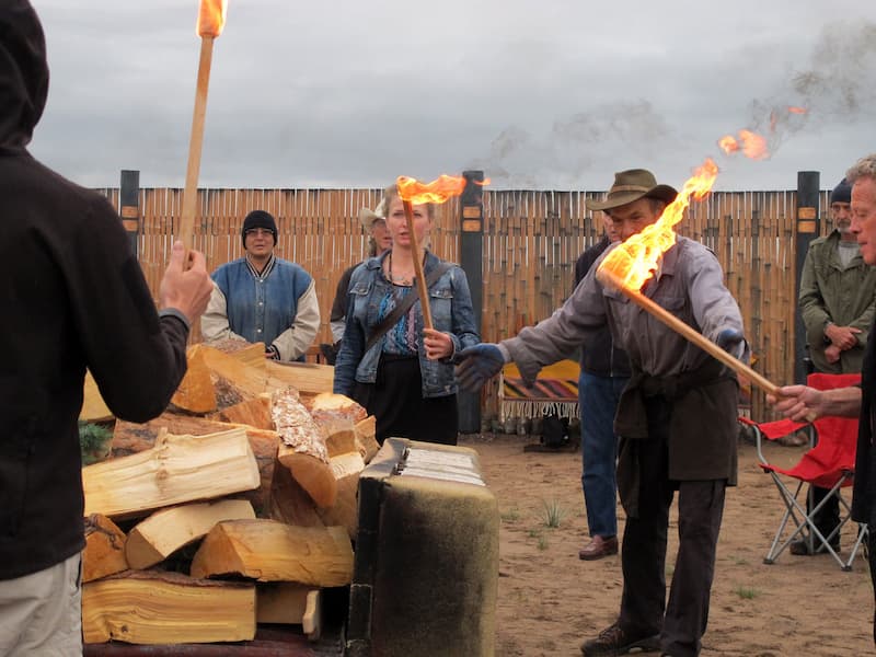 People holding burning torches