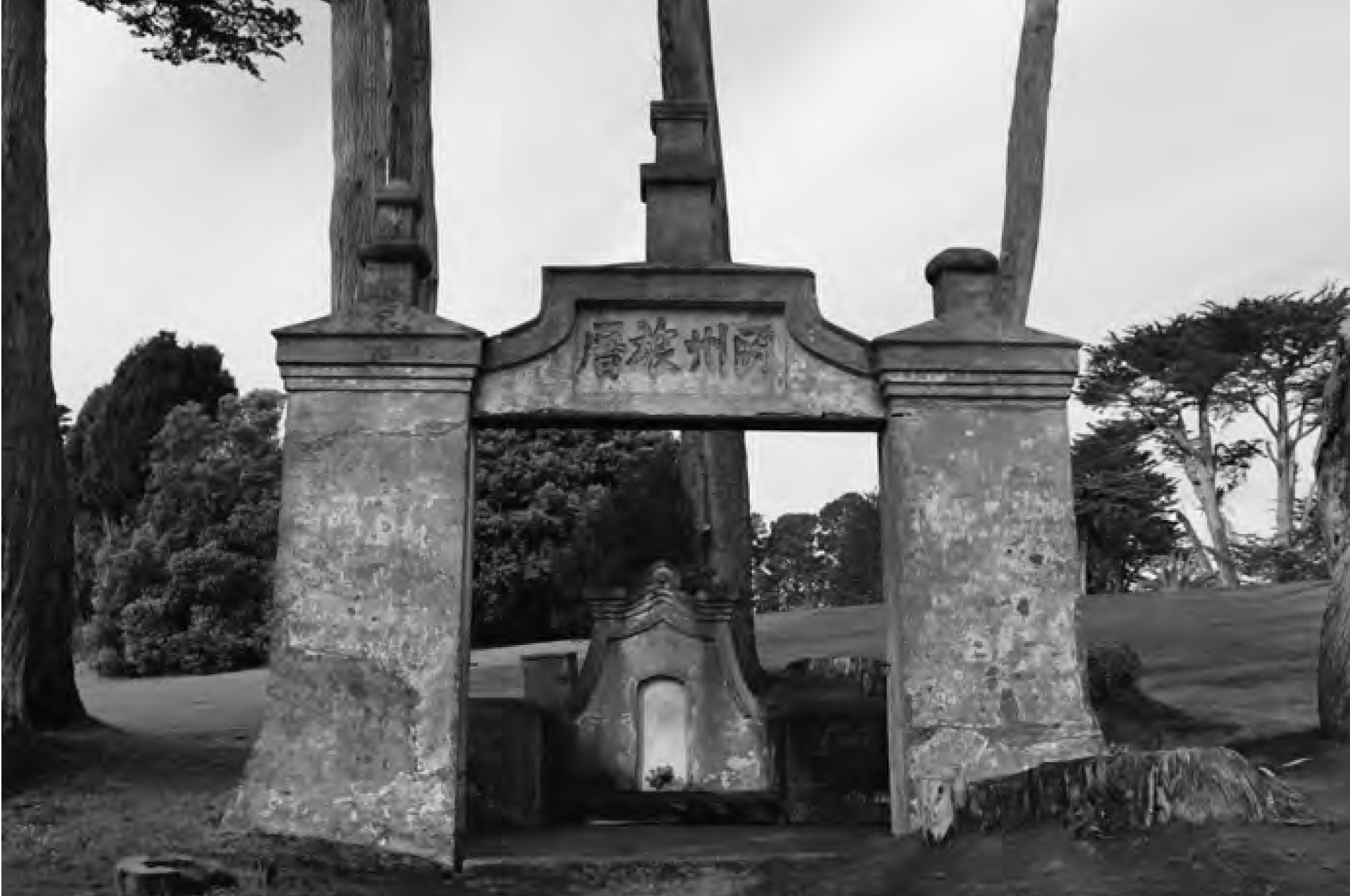 Black and white photo of a cemetery monument with chinese characters