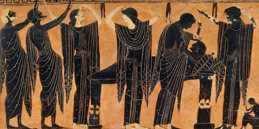 ancient greek relief featuring mourners gathered around a corpse