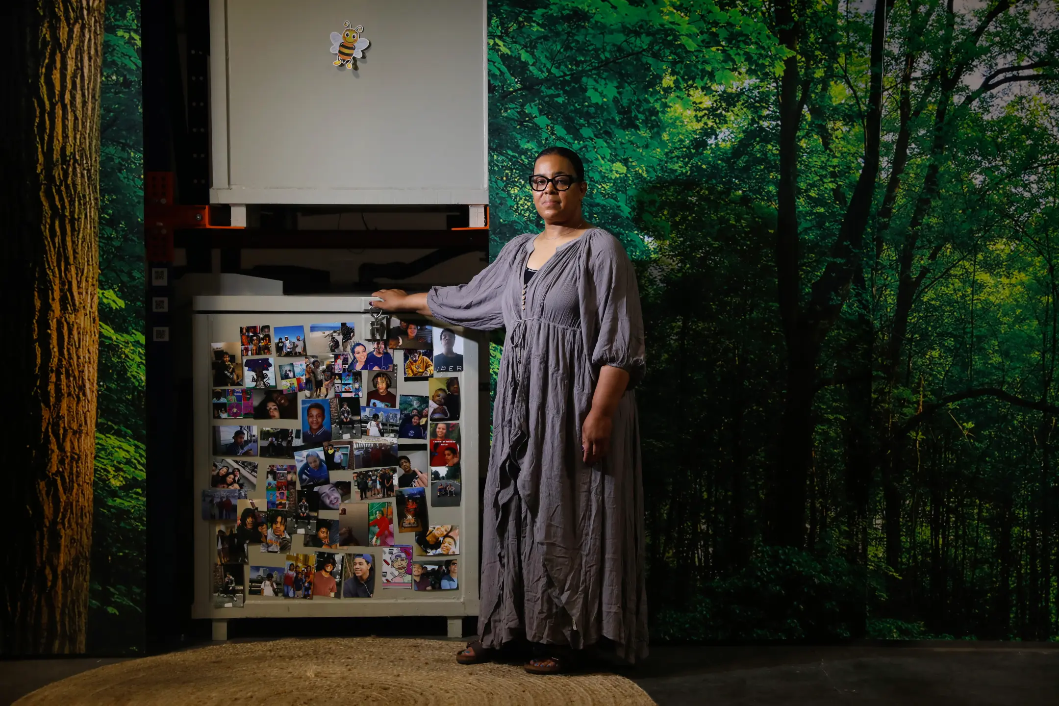 McKelle Hilber, a public school teacher in Seattle, stands beside the vessel holding her son, Samah, in the Terramation process at Return Home.